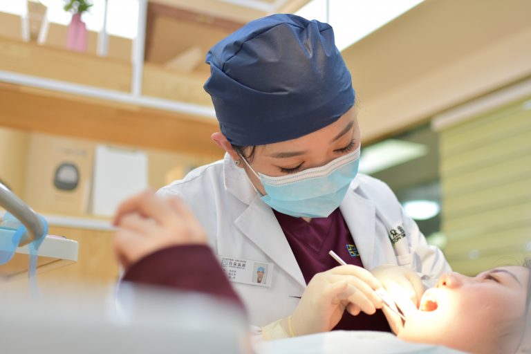 a doctor holding a baby