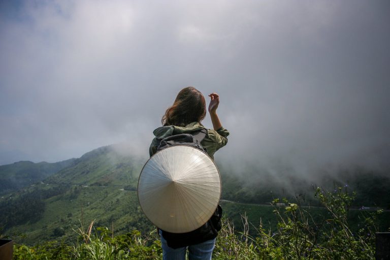 a person holding a white balloon