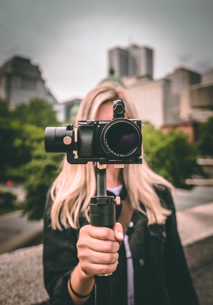 a person holding a camera