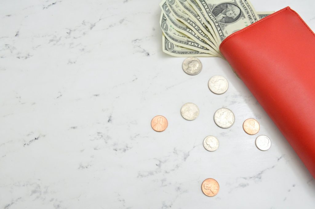 a red and white eraser on a white surface