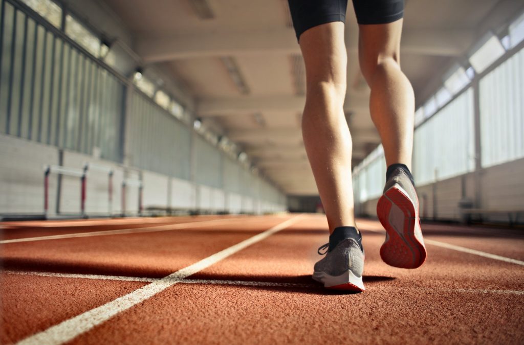 close-up of a person running on a track