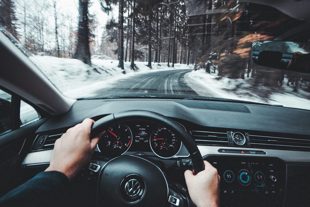 a person driving a car in the snow