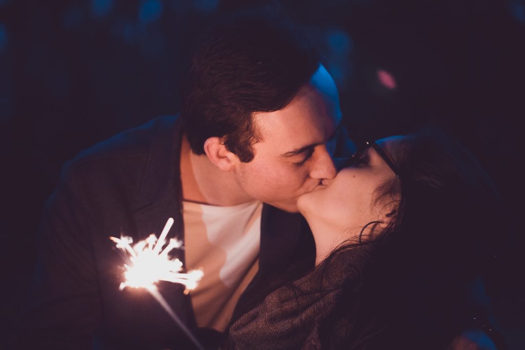 a man and a woman kissing