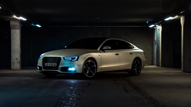 a white car parked in a garage