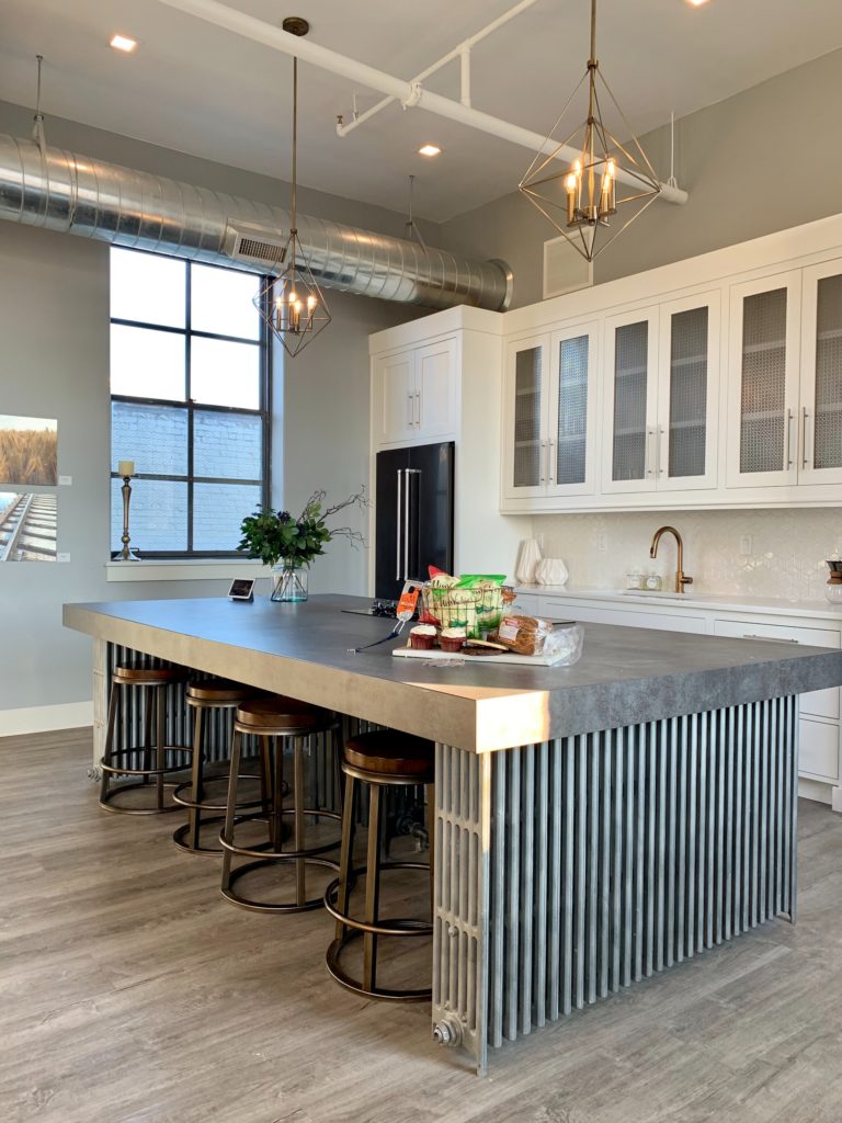 a kitchen with a bar stools