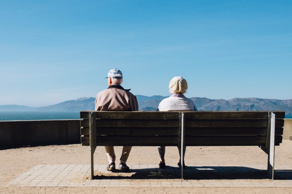 a couple sits on a bench