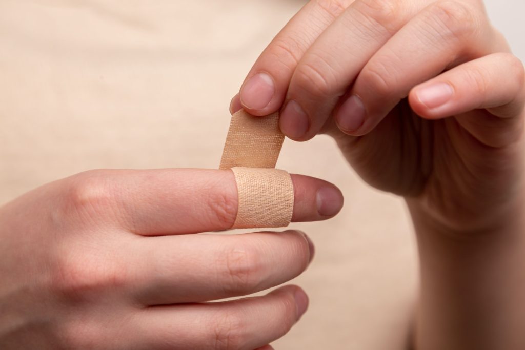 a close-up of a person holding a finger