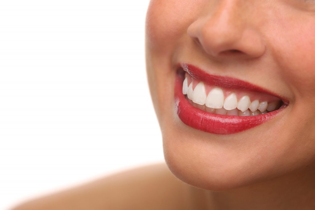 a close-up of a woman smiling