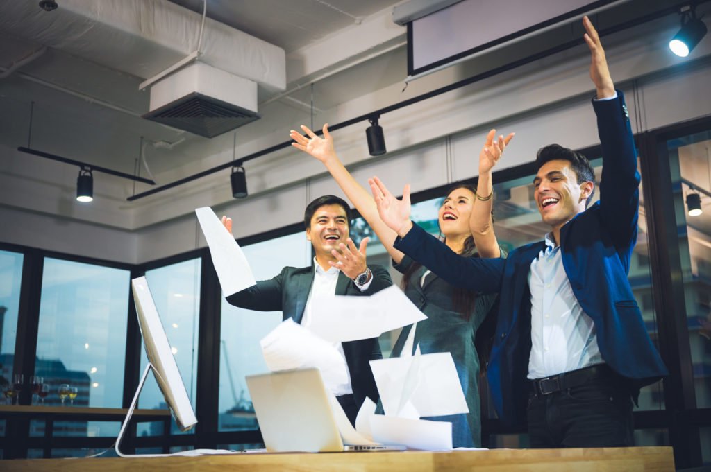 a group of people raising their hands